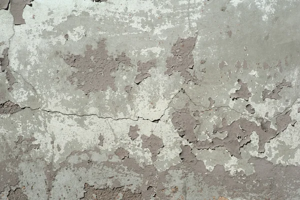纹理的老墙上覆盖着灰色的灰泥 — 图库照片