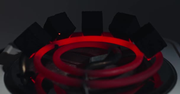 Time-lapse of burning red coals for hookah, heated on electric heater, preparing shisha at home, ashes — Vídeos de Stock