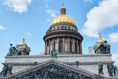 Russia, St. Petersburg, Isaac's Cathedral, 07.14.2015: A view of Isaac's Cathedral from 5 floors of the hotel 4 season, around the cathedral are many tour buses and tourists, a lot of people walking upstairs colonnade, sunny, white cloud