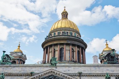 Russia, St. Petersburg, Isaac's Cathedral, 07.14.2015: A view of Isaac's Cathedral from 5 floors of the hotel 4 season, around the cathedral are many tour buses and tourists, a lot of people walking upstairs colonnade, sunny, white cloud