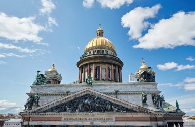 Russia, St. Petersburg, Isaac's Cathedral, 07.14.2015: A view of Isaac's Cathedral from 5 floors of the hotel 4 season, around the cathedral are many tour buses and tourists, a lot of people walking upstairs colonnade, sunny, white cloud