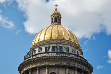 Russia, St. Petersburg, Isaac's Cathedral, 07.14.2015: A view of Isaac's Cathedral from 5 floors of the hotel 4 season, around the cathedral are many tour buses and tourists, a lot of people walking upstairs colonnade, sunny, white cloud