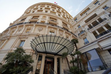 Monte-Carlo, Monaco, 25.09.2008: Hotel de Paris, bottom view, the famous canopy over the entrance to the hotel, at the top of the flag of Monaco
