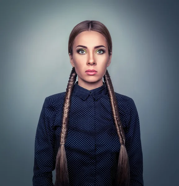 Portrait of a woman with two braids — Stock Photo, Image
