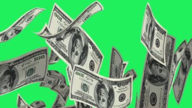 Gerçekçi dolar banknotu yeşil arka planda süzülür.