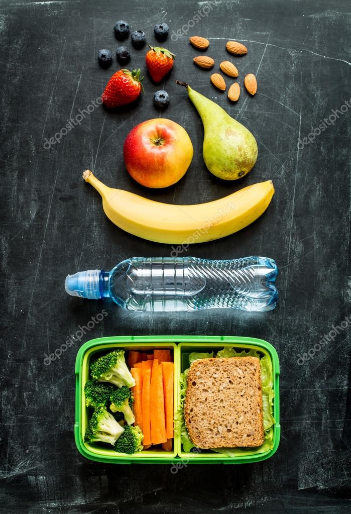 School lunch box with sandwich, vegetables, water and fruits — Stock