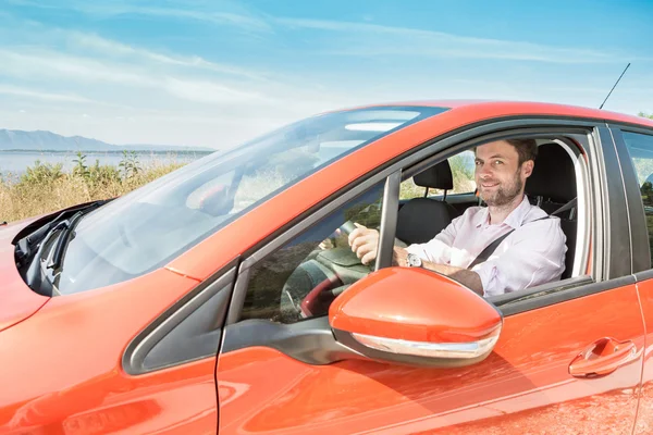 Forty years old caucasian man driving a car Royalty Free Stock Photos