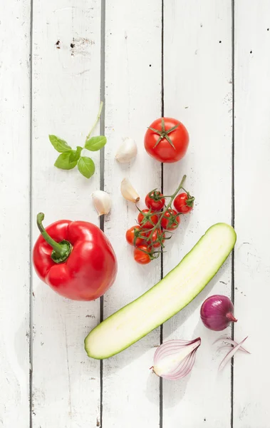 Mix of vegetables on white planked wooden background — Stok fotoğraf