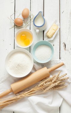 Rustic kitchen - dough recipe ingredients on white wood