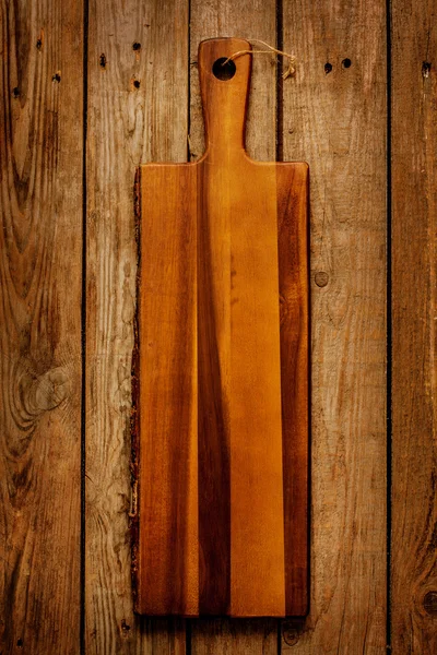 Empty vintage wooden chopping board — Stockfoto