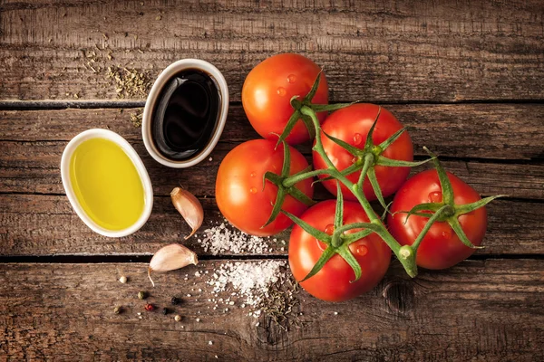 Vinaigrette dressing recipe ingredients and tomato branch — Stok fotoğraf