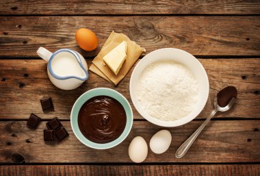 Baking chocolate cake - recipe ingredients on vintage wood