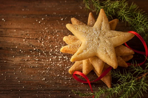 Star shaped christmas cookies on wooden background — Φωτογραφία Αρχείου