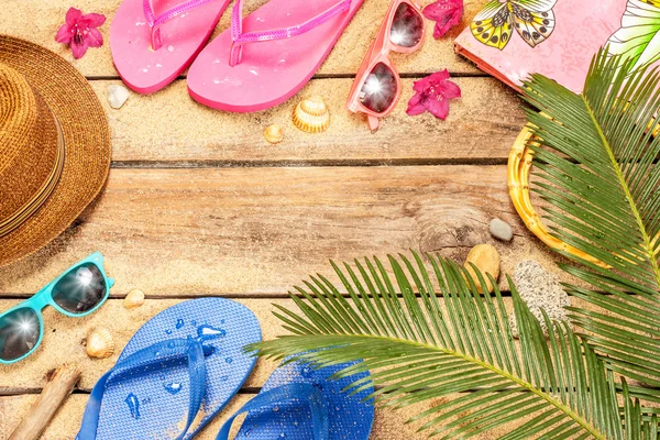 Beach, palm tree leaves, sand, sunglasses and flip flops — Stok fotoğraf