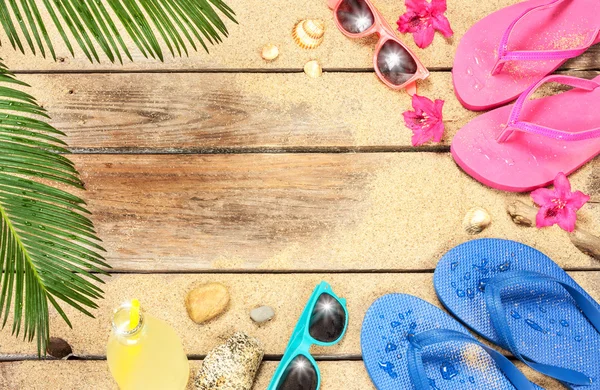 Beach, palm tree leaves, sand, sunglasses and flip flops