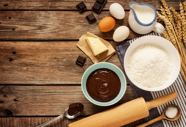 Baking chocolate cake - recipe ingredients on vintage wood — Stock Photo, Image