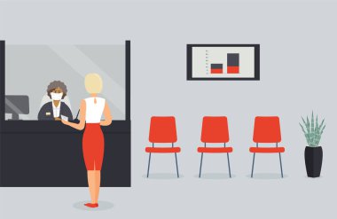 Virüs salgını sırasında banka ofisi açıktır. Tezgahın arkasındaki koruyucu tıbbi maske çalışanı müşteriye hizmet eder. Müşteri kasanın yanındaki koridorda durur ve yazmanla konuşur.