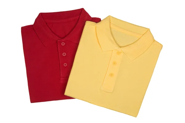 Zwei gefaltete rote und gelbe Poloshirts isoliert auf weißem Hintergrund — Stockfoto