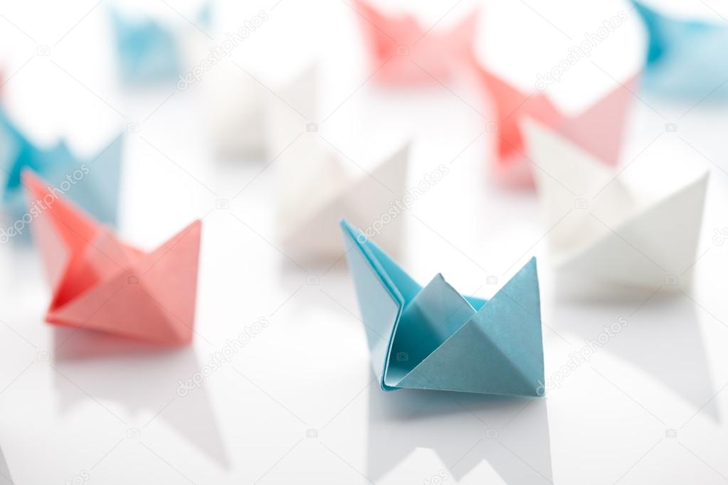 Leadership concept using paper ship