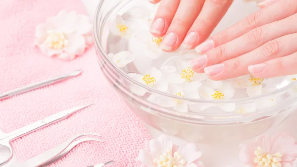 Woman hands in bath with water — Stock Photo, Image