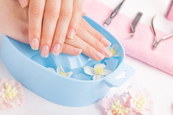 Woman hands in bath with water — Stock Photo, Image