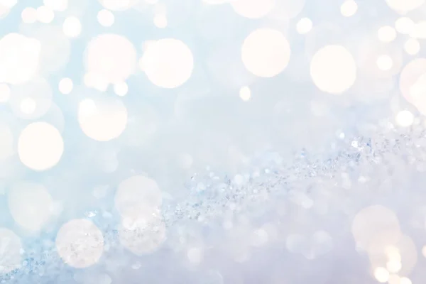 Shiny silver defocused glitter background with golden lights — 图库照片