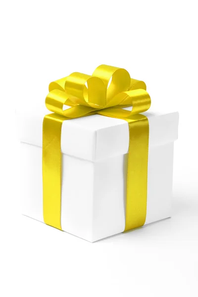 White gift box with yellow ribbon bow — Stock Photo, Image