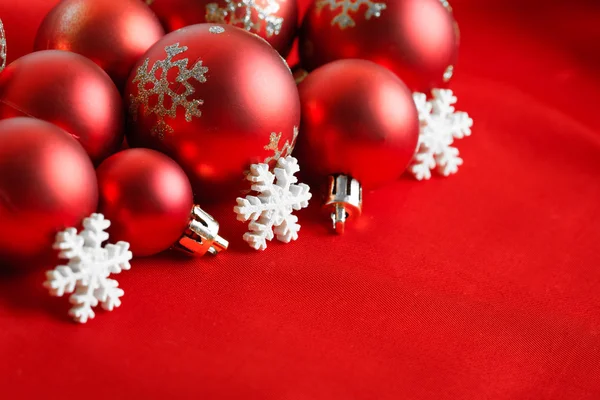 Red Christmas balls, wrapped in cloth — Stock Photo, Image