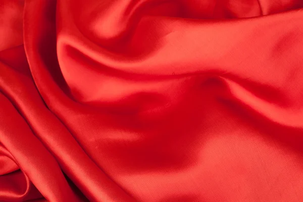 Red satin fabric against white background — Stock Photo, Image