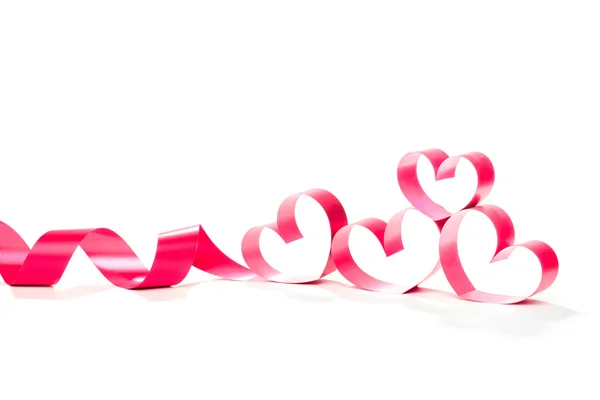 Ribbons shaped as hearts on white — Stock Photo, Image