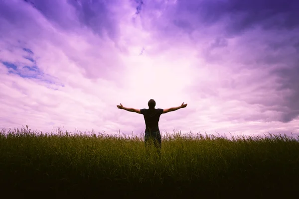 Male silhouette on sunrise background — Stock Photo, Image