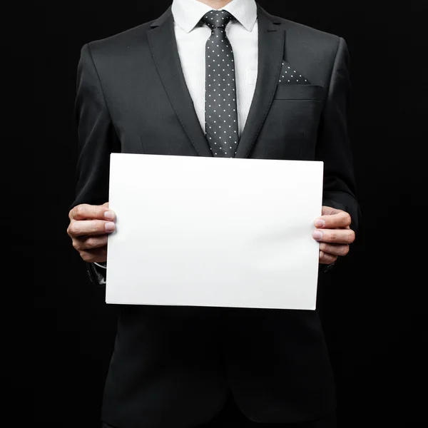 Business man holding a paper — Stock Photo, Image