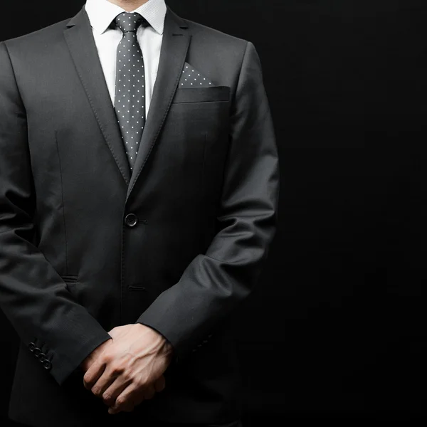 Man in suit on a black background — Stock Photo, Image