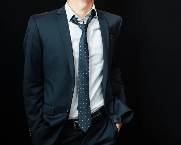 Man in suit on a black background — Stock Photo, Image