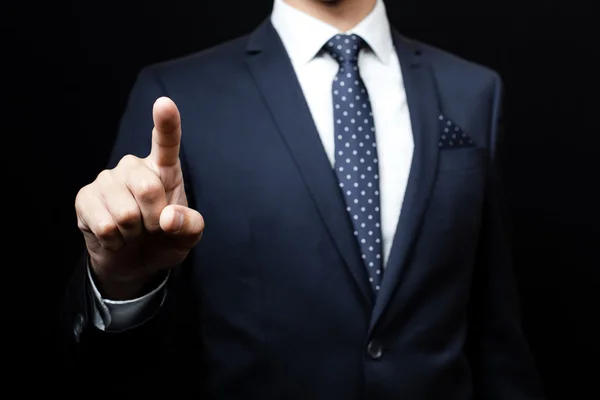 Hombre de traje sobre fondo negro — Foto de Stock