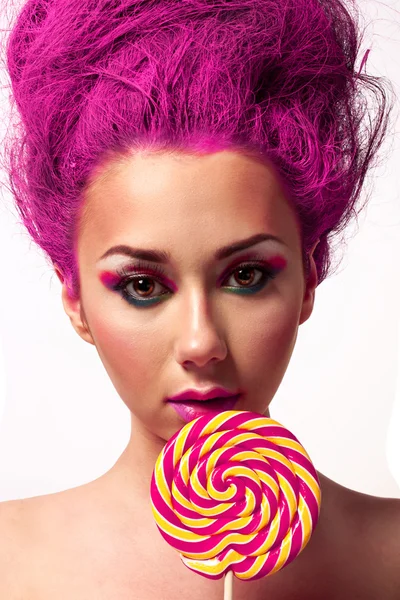 Portrait of young woman with lollipop — Stock Photo, Image