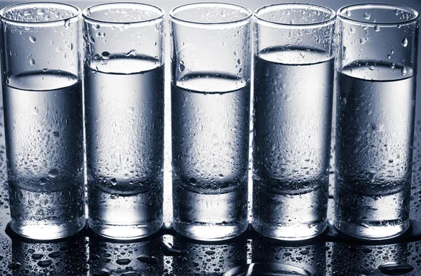 Row of glasses for vodka — Stock Photo, Image