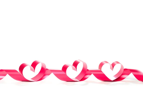 Ribbons shaped as hearts on white — Stock Photo, Image