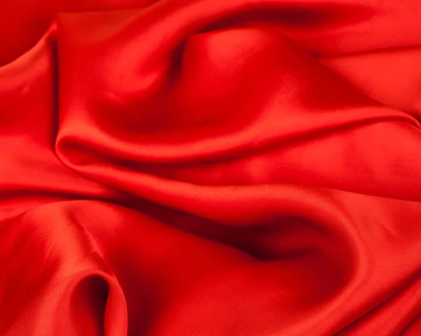 Red fabric on a white background — Stock Photo, Image