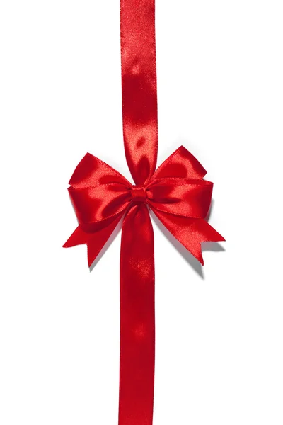 Red ribbon with bow on white — Stock Photo, Image