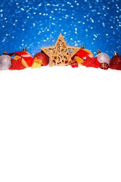 christmas star in snow on glitter blue background