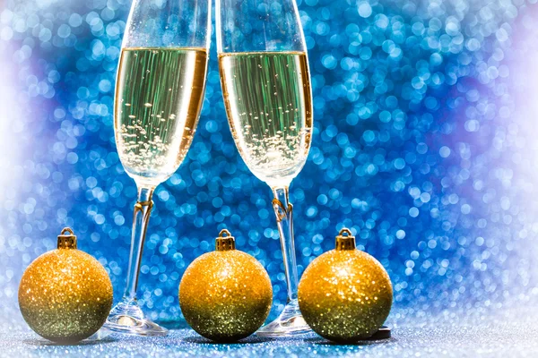 Two glasses of champagne with lights in the background — Stock Photo, Image