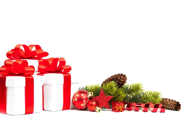 Christmas gift with red balls bow — Stock Photo, Image