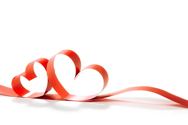 Ribbons shaped as hearts on white — Stock Photo, Image