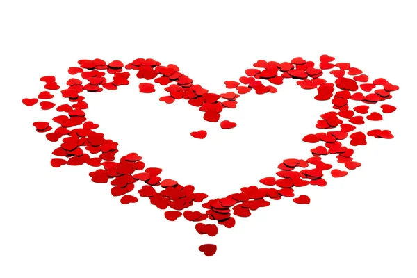 Heart silhouette made of red confetti — Stock Photo, Image