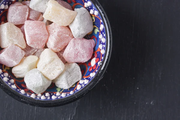 Turkish delight on a black background — Stock Photo, Image