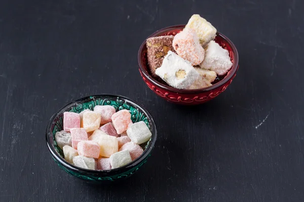 Turkish delight on a black background — Stock Photo, Image