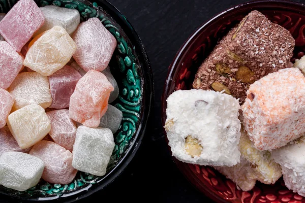 Turkish delight on a black background — Stock Photo, Image