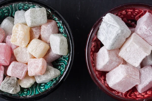 Turkish delight on a black background — Stock Photo, Image