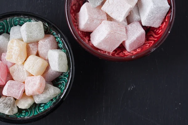 Turkish delight on a black background — Stock Photo, Image